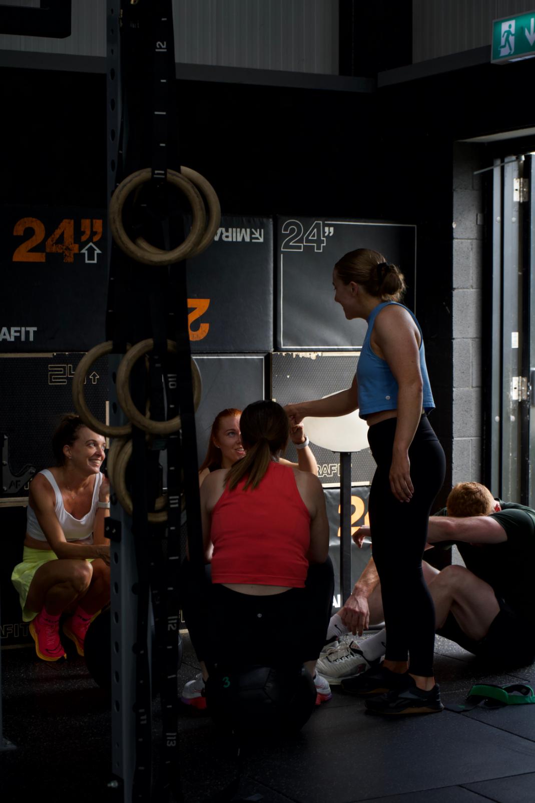 Members working on the rig with a coach alongside